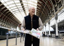 EDITORIAL USE ONLY Mike Tindall hands out copies of Sporting Life to racing enthusiasts at Paddington Station, London in celebration of the start of the Cheltenham Festival. Picture Date: Tuesday, March 11, 2025.