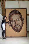 EDITORIAL USE ONLY Michelle Wibowo creates a portrait of Harry Kane out of coffee beans for Starbucks x Harry Kane Foundation, West Sussex. Picture date: Monday March 10, 2025. PA Photo.