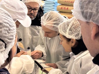 Leading Sommeliers Visiting a Rice Polishing Facility