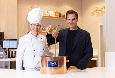 EDITORIAL USE ONLY (Left to right) Master chocolatier, Stefan Bruderer with Lindt’s global ambassador, Roger Federer at the grand opening of the new Lindt flagship London store in Piccadilly Circus. Picture date: Friday March 21, 2025. PA Photo.