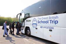 Kids getting off coach pic: Thornhill Community Academy experience first of its kind space lesson with The Hyundai Great British School Trip