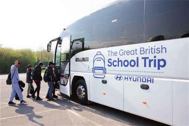Kids getting off coach pic: Thornhill Community Academy experience first of its kind space lesson with The Hyundai Great British School Trip