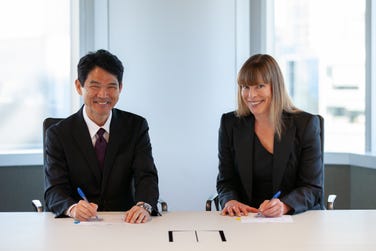 Sumitomo Metal Mining Director, Managing Executive Officer, and General Manager of the Mineral Resources Division Hideyuki Okamoto and Rio Tinto Copper Chief Executive Katie Jackson sign the Winu joint venture agreements in Perth.