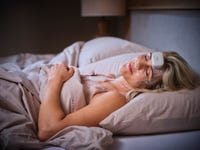 A female patient is sleeping while undergoing a sleep study with Onera Health's home Polysomnography solution.