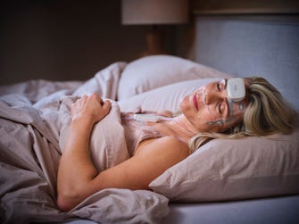 A female patient is sleeping while undergoing a sleep study with Onera Health's home Polysomnography solution.