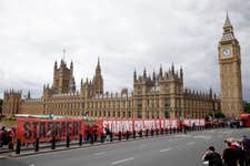 EDITORIAL USE ONLY People take part in a pro-Palestine protest on Westminster Bridge in London, as over ten thousand people form a red line around the Houses of Parliament calling for Prime Minister Sir Keir Starmer to sanction Israel after it continues its military offensive and aid blockade in Gaza. The banner reads: Starmer! Starving Children is a Red Line. Arms Embargo now. Picture date: Wednesday June 4, 2025.