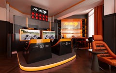 The elevated suite features a heritage hub with iconic McLaren F1 Team memorabilia on display, twin racing simulators, a pit wall with high-intensity race day content, an in-room bar and a smoothie delivery each morning. (Photo: Hilton)