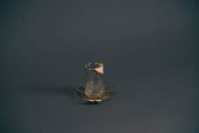 The Sudan mug, part of the 'Fragments of Hope' Kintsugi tea set, powerfully represents the journey of Bashir, a renowned poet and musician from Sudan. Crafted from elements of traditional Sudanese tea sets, this piece embodies the strength found in rebuilding a life after forced displacement. Like the art of Kintsugi, it transforms past challenges, symbolising hope and an enduring spirit.