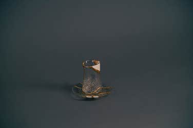 The Sudan mug, part of the 'Fragments of Hope' Kintsugi tea set, powerfully represents the journey of Bashir, a renowned poet and musician from Sudan. Crafted from elements of traditional Sudanese tea sets, this piece embodies the strength found in rebuilding a life after forced displacement. Like the art of Kintsugi, it transforms past challenges, symbolising hope and an enduring spirit.