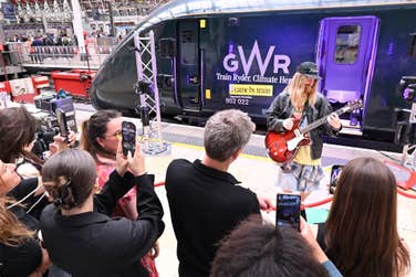 EDITORIAL USE ONLY Sam Ryder performs an impromptu gig at London Paddington Station at the unveiling of his newly branded ‘Train Ryder’ Great Western Railway train, which is part of the ‘I came by train’ campaign, supported by Trainline to encourage sustainable travel to Glastonbury Festival and beyond. Picture date: Monday June 23, 2025. PA Photo. The one-off special train will be in service over the summer, as part of a major sustainability initiative, aimed at shifting behaviours around travel. With transport making up the biggest slice of the average UK citizen's carbon footprint, choosing the train is a simple but powerful climate action change.