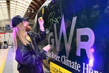 EDITORIAL USE ONLY Sam Ryder performs an impromptu gig at London Paddington Station at the unveiling of his newly branded ‘Train Ryder’ Great Western Railway train, which is part of the ‘I came by train’ campaign, supported by Trainline to encourage sustainable travel to Glastonbury Festival and beyond. Picture date: Monday June 23, 2025. PA Photo. The one-off special train will be in service over the summer, as part of a major sustainability initiative, aimed at shifting behaviours around travel. With transport making up the biggest slice of the average UK citizen's carbon footprint, choosing the train is a simple but powerful climate action change.