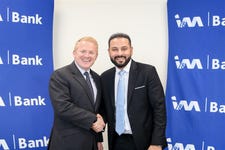 Peter Reynolds , CEO of ThetaRay, and Gul Khan, CEO of I&M Bank, shake hands following the signing of strategic partnership agreement.