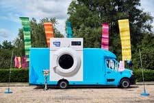 The Wash Pit, British Gas' giant pop-up launderette is rolling into Leigh Delamere Service Station on Monday 30th to clean up the country’s dirtiest festival gear and save parent's energy - for the home and for themselves