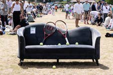 EDITORIAL USE ONLY: General view of a preloved sofa delivered by the British Heart Foundation to the Wimbledon queue, giving those waiting in line a chance to rest their legs and take a break. Picture date: Tuesday July 8, 2025. PA Photo. The sofa, sourced from the local Kingston British Heart Foundation store, showcases the charity’s wide range of second-hand furniture and highlights its nationwide delivery service.