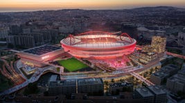 Benfica - New masterplan for the Estádio da Luz Stadium, designed by Populous: Night-time aerial image.