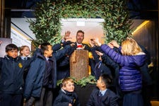 EDITORIAL USE ONLYPrimary School Bangers' James B Partridge switches on the Christmas lights at Fulham Pier alongside pupils from St. John's Walham Green CE Primary School, as the riverside destination launches its festive ‘Into the Woods’ season, with pine trees, illuminated riverwalk paths, interactive art, and a programme of family-friendly events available to visitors from today until January 2026, London. Picture date: Thursday November 20, 2025. PA Photo.