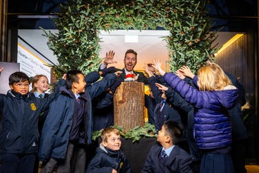 EDITORIAL USE ONLYPrimary School Bangers' James B Partridge switches on the Christmas lights at Fulham Pier alongside pupils from St. John's Walham Green CE Primary School, as the riverside destination launches its festive ‘Into the Woods’ season, with pine trees, illuminated riverwalk paths, interactive art, and a programme of family-friendly events available to visitors from today until January 2026, London. Picture date: Thursday November 20, 2025. PA Photo.