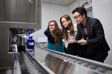 Photo credit: IFF - Colleagues at IFF Chin Bee with the site's new smart-dosing robot.