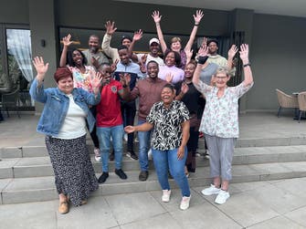 Qotho Minerals team celebrating acquisition