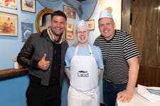 EDITORIAL USE ONLY (left to right) Aljaz Skorjanec, professional dancer, Matt Lucas, and John Vincent, co-founder of LEON, open ‘The LEON Chippy’ fish and chip pop-up at LEON Regent Street in London, created to reimagine the traditional British takeaway and celebrate the return of the restaurant’s Fish Finger Wrap. Picture date: Friday March 13, 2026. PA Photo. The dish is the first to return as part of LEON’s new Icon Dishes series, a programme bringing back signature menu items with updated recipes.
