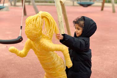 EDITORIAL USE ONLY Yumna from London, age 6, who was diagnosed with neuroblastoma shortly after her 2nd birthday, with her mum Salma Bibi alongside replica chemotherapy‑wire sculptures installed at London’s Queen Elizabeth Olympic Park by Great Ormond Street Hospital Charity and created by Andy Goff to highlight the impact of rising childhood cancer diagnoses on families across the UK, as part of the charity’s mission to ensure every child has the best chance and best childhood possible. Picture date: Tuesday March 17, 2026. PA Photo.