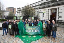 EDITORIAL USE ONLY Campaigners gather outside the Royal Courts of Justice in Belfast in support of eel fisherman Declan Conlon’s judicial review against the Department of Agriculture, Environment and Rural Affairs (DAERA), challenging its management of agricultural pollution in Lough Neagh. Picture date: Tuesday March 24, 2026. PA Photo. The lake, the largest in the United Kingdom and Ireland and a source of nearly half of Northern Ireland’s drinking water, has experienced repeated blue-green algal blooms and ecological decline, reportedly visible from space.