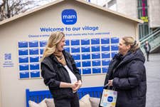 EDITORIAL USE ONLY (left to right) Podcaster Hannah Cooper-Dommett speaks with new mum Jodie Banks, as she unveils the MAM Baby ‘Be the Village’ installation in Liverpool, featuring a collection of 50 letters from mums across the country addressed to the next generation of parents, highlighting the realities of first-time motherhood. Picture date: Tuesday March 24, 2026. PA Photo. The campaign marks the 50th anniversary of the baby products manufacturer and follows research revealing that mums in the North-West of England rated the size and quality of their support networks the lowest.