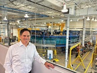 Scott Gardner, President, Svante Development, stands at Svante's headquarters in Burnaby, BC, Canada, in front of the company's commercial-sized carbon capture machine, "Ursa 1000".