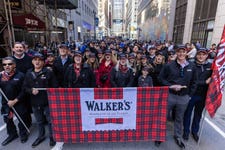 EDITORIAL USE ONLY Representatives from Walker’s Shortbread march along 44th Street in New York City, USA, during the New York City Tartan Day Parade, led by the Robert Gordon’s College pipe band, part of New York City Tartan Week sponsored by Walker’s Shortbread. Issue date: Sunday April 12, 2026. PA Photo.