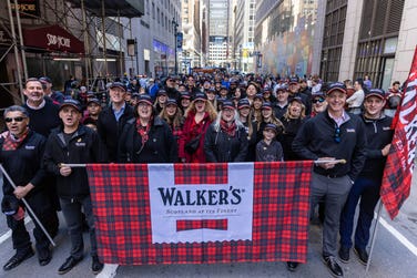 EDITORIAL USE ONLY Representatives from Walker’s Shortbread march along 44th Street in New York City, USA, during the New York City Tartan Day Parade, led by the Robert Gordon’s College pipe band, part of New York City Tartan Week sponsored by Walker’s Shortbread. Issue date: Sunday April 12, 2026. PA Photo.