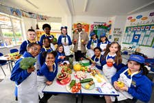 JLS star turned farmer JB Gill with classroom heroes.