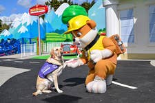 Assistance dog Sophie alongside Paw Patrol character Rubble during a preview of the UK’s first and only PAW Patrol-themed land, World of PAW Patrol at Chessington World of Adventures, ahead of the attraction opening to the public on Sunday. Issue date: Monday April 27, 2026. PA Photo. Photo credit should read: Jas Lehal/PA Media Assignments