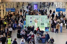 EDITORIAL USE ONLY Tasha Ghouri stands inside a large transparent box installed by RNID (Royal National Institute for Deaf People) at St. Pancras International Station in London to mark Deaf Awareness Week, designed to highlight the communication challenges faced by deaf people and those with hearing loss. Picture date: Wednesday May 6, 2026. PA Photo. The installation invites members of the public to step inside the box to better understand communication barriers, following research showing that almost a quarter of people would avoid conversations with someone who is deaf or has hearing loss if they think it would be difficult to communicate.