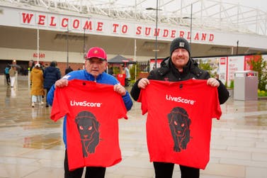 EDITORIAL USE ONLY Supporters hold black dog T-shirts at the Stadium of Light, home of Sunderland AFC, where the club’s principal partner LiveScore has replaced the Black Cat logo with a black dog to mark Mental Health Awareness Week, in Sunderland. Picture date: Saturday May 9, 2026. PA Photo. The ‘black dog’, a metaphor commonly associated with depression, is part of an initiative to prompt conversations around mental health, with research showing that the North East of England records the highest suicide rates of any region in the country.