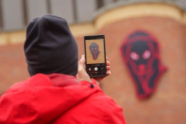 EDITORIAL USE ONLY Sunderland fan takes a photo of the temporary Black Dog on the Black Cat House next to the Stadium of Light, home of Sunderland AFC, where the club’s principal partner LiveScore has replaced the Black Cat logo with a black dog to mark Mental Health Awareness Week, in Sunderland. Picture date: Saturday May 9, 2026. PA Photo. The ‘black dog’, a metaphor commonly associated with depression, is part of an initiative to prompt conversations around mental health, with research showing that the North East of England records the highest suicide rates of any region in the country.