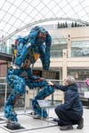 EDITORIAL USE ONLY Passerby interacts with Anguish, a 2.4 metre sculpture constructed from reclaimed tools by artist Ptolomy Erlington in partnership with Wickes, at Leeds Trinity Shopping Centre, highlighting the emotional and financial impact of tool theft in one of the UK’s hardest‑hit regions. Picture date: Wednesday May 27, 2026. PA Photo.