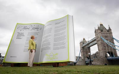 EDITORIAL USE ONLY Selina Vickers, ancestor of Dr Annie Wainwright Hyatt, views the ‘Missing Pages’ installation, unveiled by Ancestry in London to launch ‘The Parity Principle’, a new framework aimed at ensuring women from the past are recognised and celebrated for their contributions to society. Picture date: Wednesday June 3, 2026. PA Photo. The activation highlights new Ancestry research revealing that men are mentioned more than four times as often as women in UK Key Stage 3 history textbooks, while more than half of the public admit they are more confident naming male historical figures than female ones.