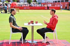 EDITORIAL USE ONLY Sir Andy Murray (right) talks with Jamie Murray during his visit to The 2026 HSBC Championships at the Queen’s Club in London with Walker’s Shortbread, meeting fans in his role as the brand’s ‘Spectator Coach’. Issue date: Monday June 22, 2026. PA Photo. The initiative marks Walker’s Shortbread’s debut as an official supporter of the 2026 HSBC Championships.
