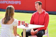 EDITORIAL USE ONLY Sir Andy Murray (right) talks with Lily Conn during his visit to The 2026 HSBC Championships at the Queen’s Club in London with Walker’s Shortbread, meeting fans in his role as the brand’s ‘Spectator Coach’. Issue date: Monday June 22, 2026. PA Photo. The initiative marks Walker’s Shortbread’s debut as an official supporter of the 2026 HSBC Championships.