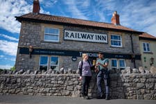 EMBARGOED TO 0001 THURSDAY JUNE 25 EDITORIAL USE ONLY Laura Cureton and Dan Mukherjee take a break during a Thatchers Cider and OS Maps ‘Pint Sized Walk’ at The Railway Inn in Sandford, Somerset as the brands launch new UK trails linking walking routes with pubs. Issue date: Thursday June 25, 2026. PA Photo.