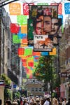 EDITORIAL USE ONLYGeneral view of Carnaby Street in London, where the newly unveiled ‘¡Frida Icónica!’, a public art installation featuring papel picado banners and a large-scale mural inspired by the life and work of Frida Kahlo, has launched in collaboration with Tate Modern ahead of today’s opening of the exhibition ‘Frida: The Making of an Icon’. Picture date: Thursday June 25, 2026. PA Photo.
