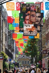 EDITORIAL USE ONLYGeneral view of Carnaby Street in London, where the newly unveiled ‘¡Frida Icónica!’, a public art installation featuring papel picado banners and a large-scale mural inspired by the life and work of Frida Kahlo, has launched in collaboration with Tate Modern ahead of today’s opening of the exhibition ‘Frida: The Making of an Icon’. Picture date: Thursday June 25, 2026. PA Photo.