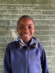 Gugulethu from Zimbabwe, who lives with his grandparents, uncle and two sisters after his parents migrated to South Africa. Before Mary’s Meals was introduced at his school, hunger often kept Gugulethu at home. When he did attend, he found it difficult to concentrate.