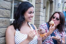 EDITORIAL USE ONLY (left to right) Ava Regan and Paula Peacock try the new ‘Sundae Roast’, an ice cream served in an Aunt Bessie’s Yorkshire Pudding, created as a limited-edition menu item at the family-run Yorkshire Dales Ice Cream company in Skipton. Picture date: Wednesday July 22, 2026. PA Photo. The dessert combination is available in-store until July 31 and can also be recreated at home using an air fryer in around five minutes.