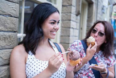 EDITORIAL USE ONLY (left to right) Ava Regan and Paula Peacock try the new ‘Sundae Roast’, an ice cream served in an Aunt Bessie’s Yorkshire Pudding, created as a limited-edition menu item at the family-run Yorkshire Dales Ice Cream company in Skipton. Picture date: Wednesday July 22, 2026. PA Photo. The dessert combination is available in-store until July 31 and can also be recreated at home using an air fryer in around five minutes.