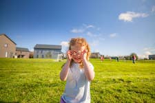 Bluestone National Park Resort's summer programme, A Summer of Salt and Soil, which encourages child-led exploration, outdoor adventure and family connection in the heart of the Pembrokeshire Coast National Park.